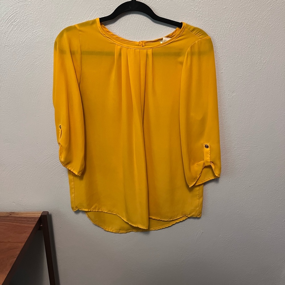 Brenda’s deep gold tunic